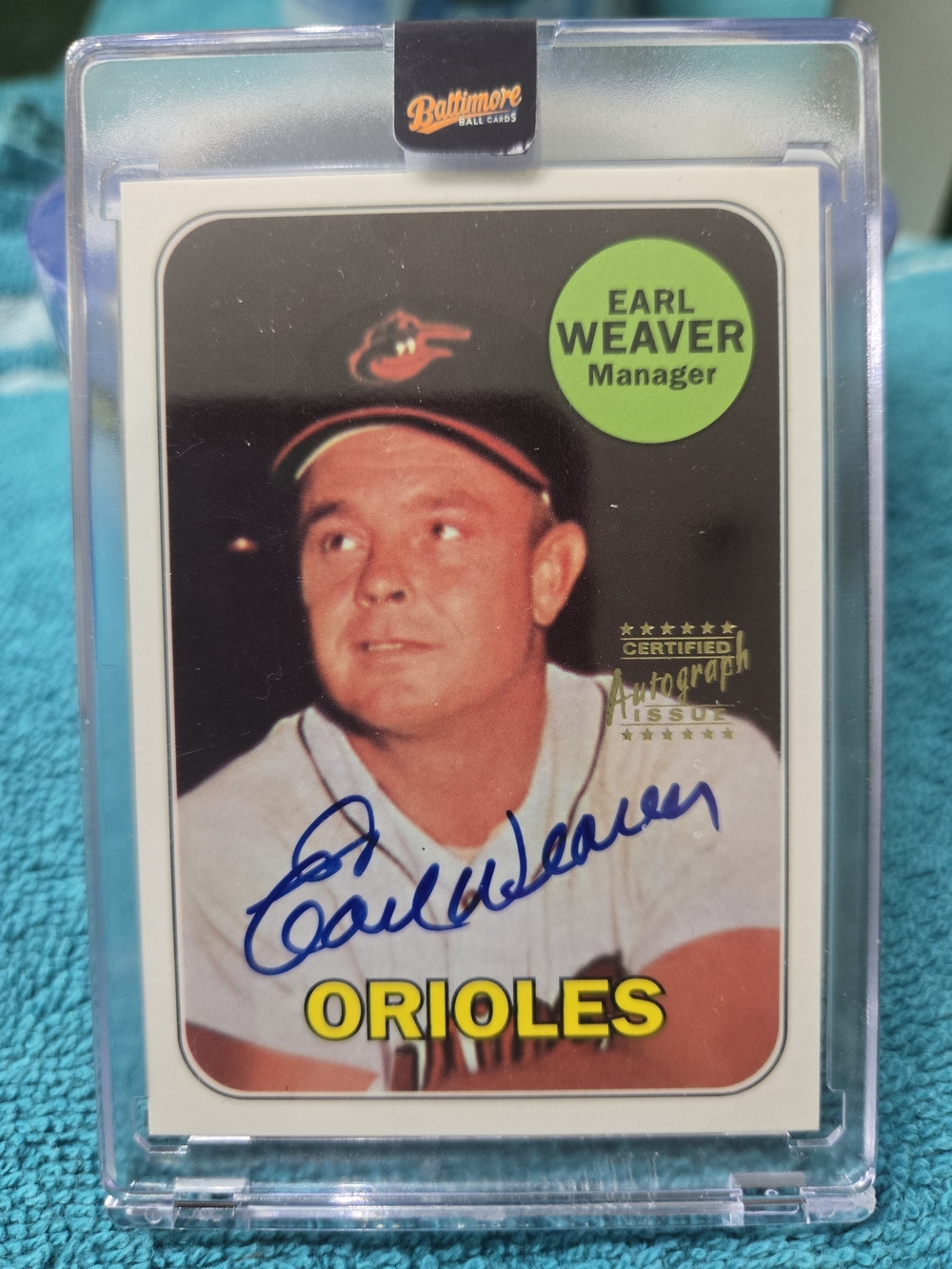 Topps Orioles Trading Card with Green Accent and Blue Signature
